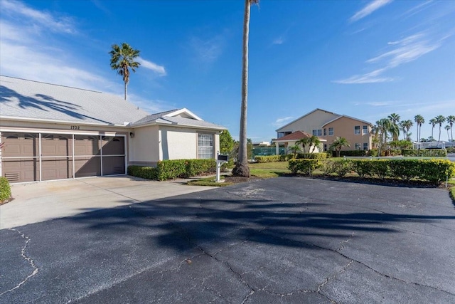 view of side of property with a garage