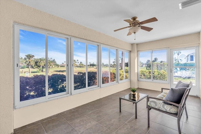 sunroom with ceiling fan and a wealth of natural light