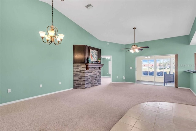 unfurnished living room featuring ceiling fan with notable chandelier, light carpet, and high vaulted ceiling