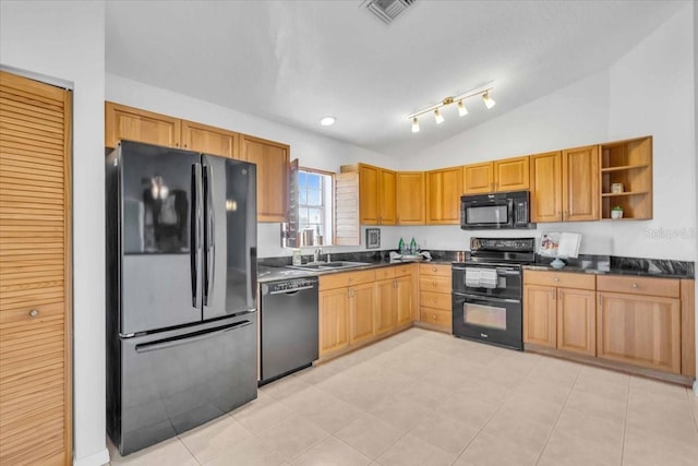 kitchen with sink, black appliances, and lofted ceiling