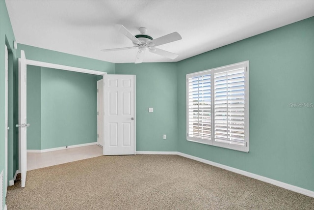 unfurnished bedroom with ceiling fan and carpet floors