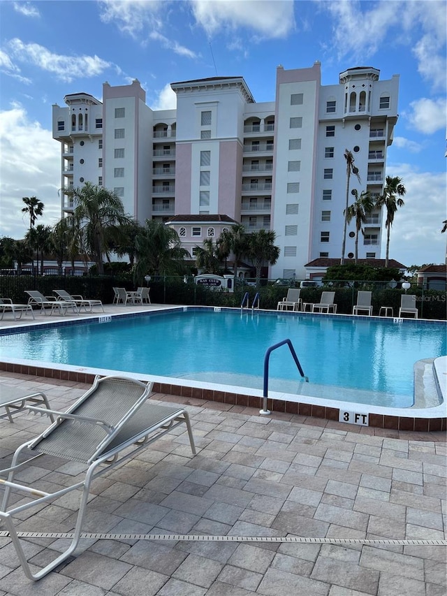 view of swimming pool with a patio