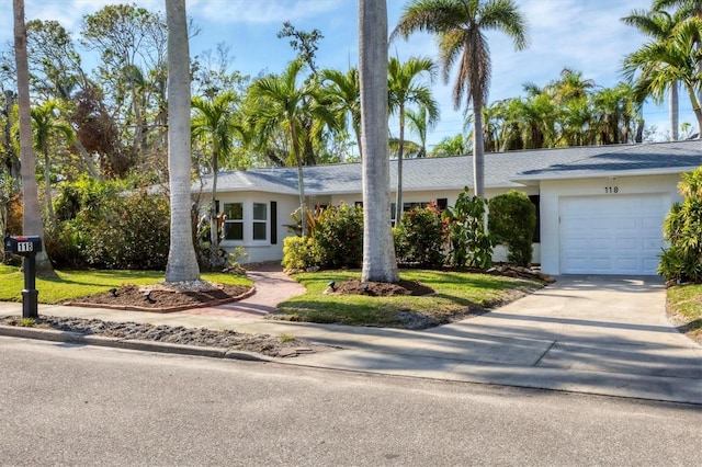 ranch-style home with a garage