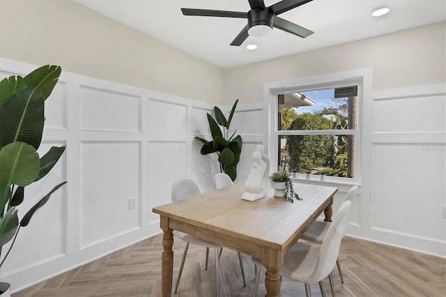 dining space featuring ceiling fan and light parquet floors