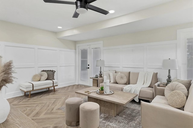 living room featuring ceiling fan, french doors, and light parquet flooring