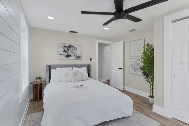 bedroom featuring hardwood / wood-style flooring and ceiling fan