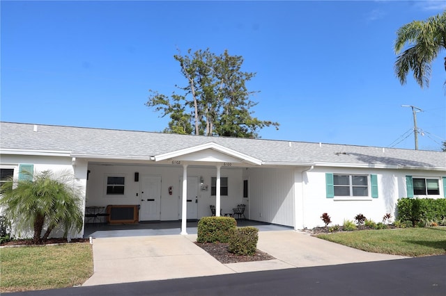 ranch-style home featuring a carport