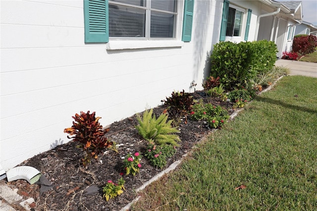 view of side of property with a yard