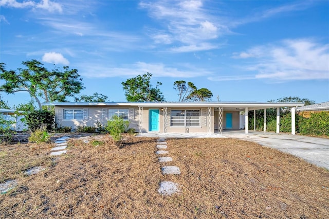 single story home with a carport