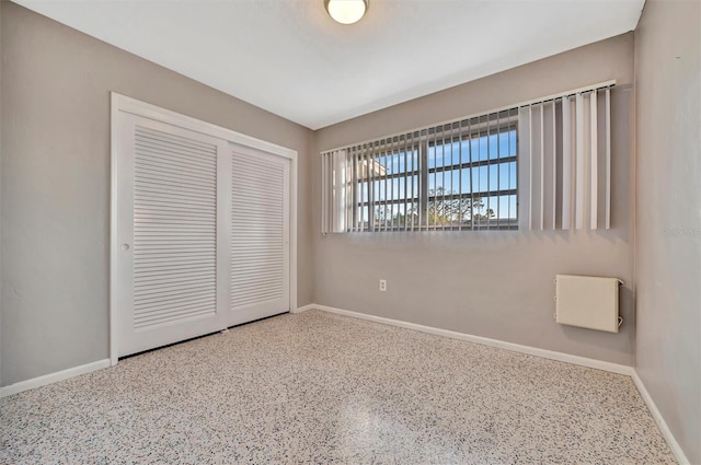 unfurnished bedroom featuring a closet