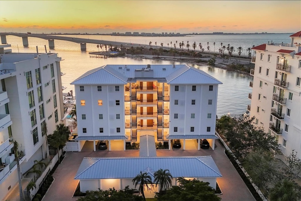 aerial view at dusk with a water view