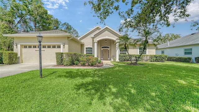 single story home featuring a garage and a front yard