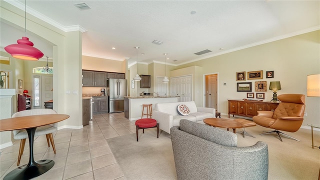 living room with crown molding and light tile patterned floors