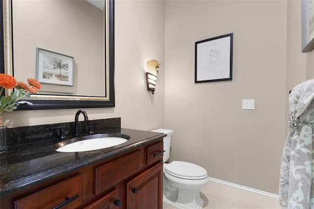 bathroom with toilet and vanity