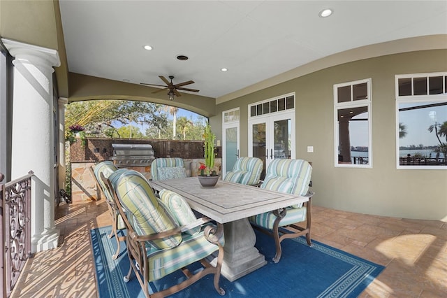 view of patio featuring grilling area, french doors, exterior kitchen, and ceiling fan