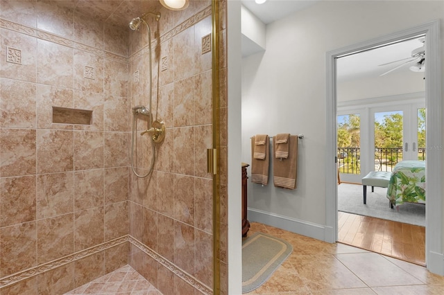 bathroom with tile patterned floors, ceiling fan, and walk in shower