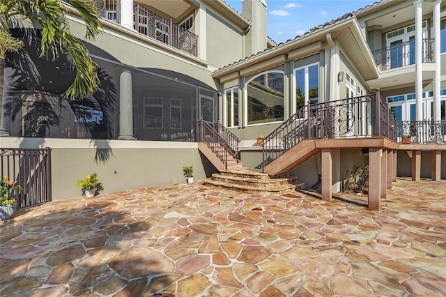 view of patio / terrace with a sunroom