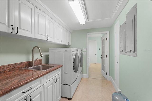 laundry room with sink, separate washer and dryer, and cabinets