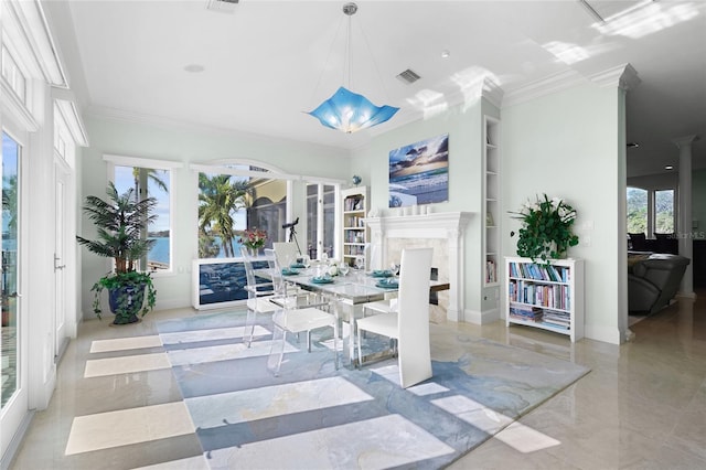 sunroom / solarium featuring ornate columns