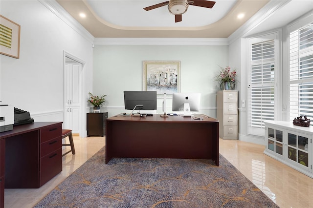 office featuring crown molding, a tray ceiling, and ceiling fan