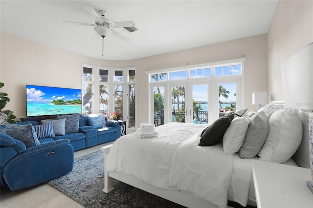 bedroom with french doors, ceiling fan, and access to outside