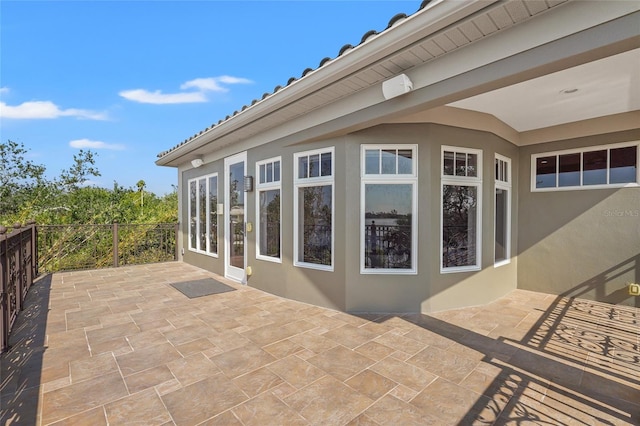 view of side of home featuring a patio area