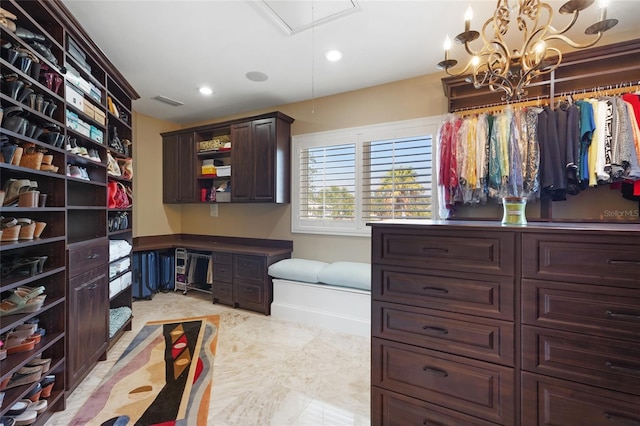 walk in closet featuring built in desk