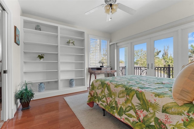 bedroom with hardwood / wood-style floors, french doors, ceiling fan, and access to exterior