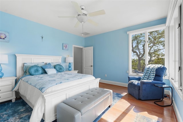 bedroom featuring hardwood / wood-style flooring and ceiling fan