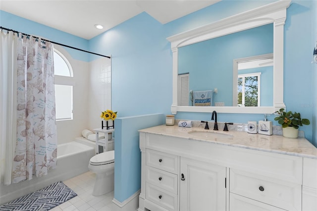 full bathroom with shower / tub combo with curtain, toilet, vanity, and tile patterned flooring