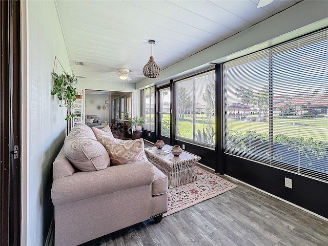 sunroom / solarium with ceiling fan