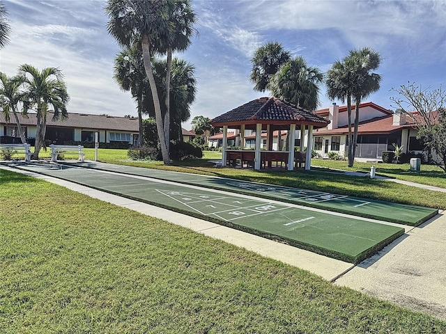 view of property's community featuring a gazebo and a lawn