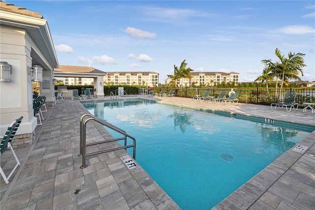 view of swimming pool with a patio area