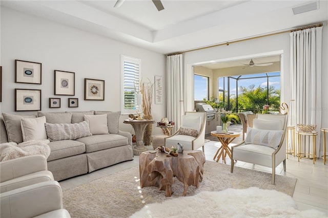 tiled living room with ceiling fan