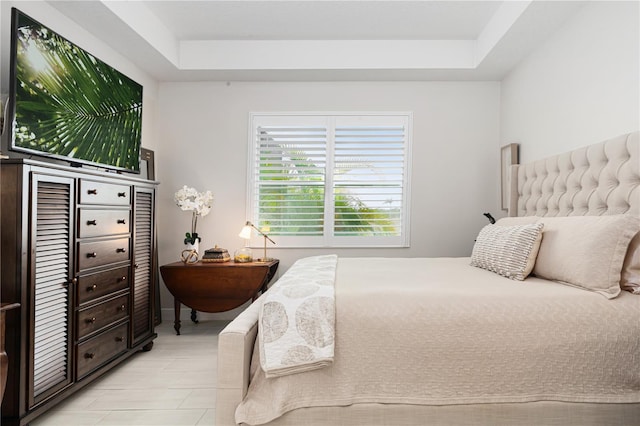 bedroom with a raised ceiling