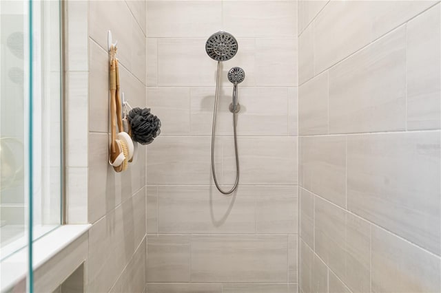 bathroom with a tile shower