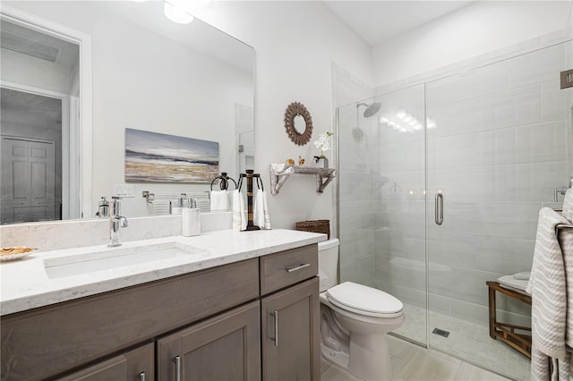 bathroom with vanity, toilet, and walk in shower