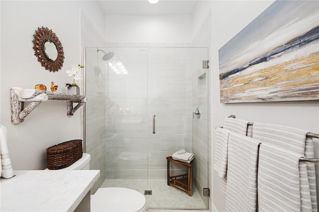 bathroom with vanity, toilet, and walk in shower