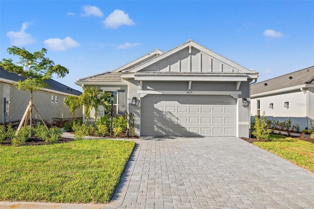 view of front of home with a garage and a front yard