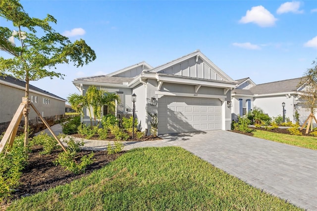 view of front of house with a garage and a front yard