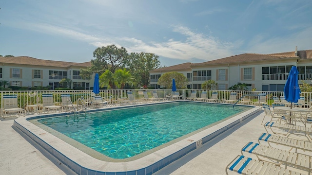 view of swimming pool featuring a patio