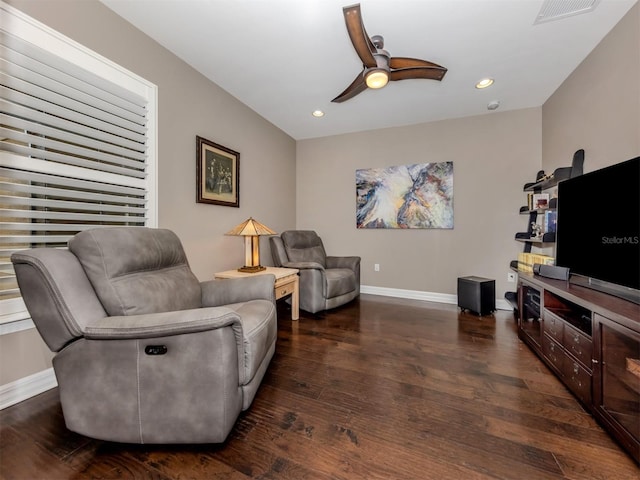 sitting room featuring ceiling fan and dark hardwood / wood-style flooring