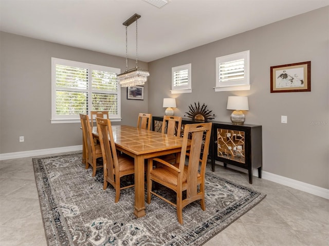 dining room with light tile patterned flooring