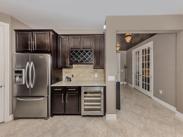 kitchen with decorative backsplash, stainless steel fridge with ice dispenser, wine cooler, and dark brown cabinets