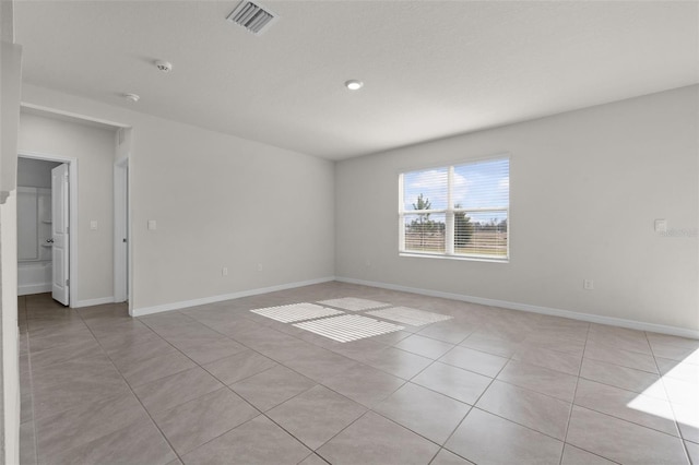 spare room with light tile patterned floors