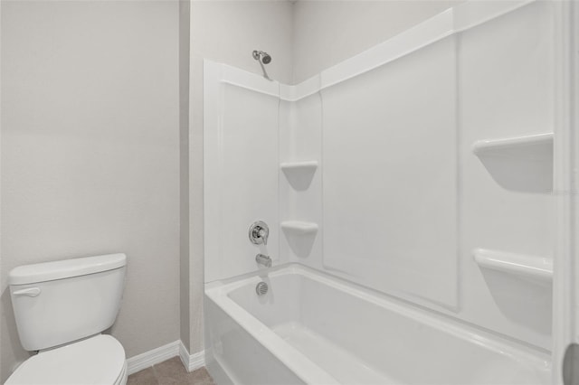 bathroom with shower / washtub combination and toilet