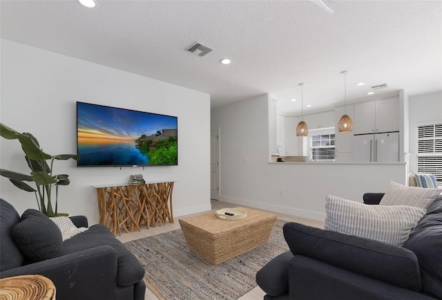 living room with a textured ceiling