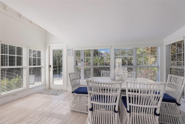 sunroom / solarium featuring a healthy amount of sunlight