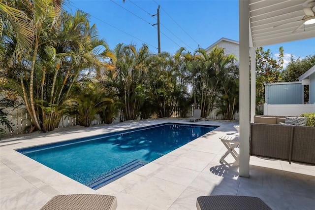 view of pool with outdoor lounge area and a patio area