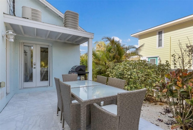 view of patio / terrace with a grill and french doors